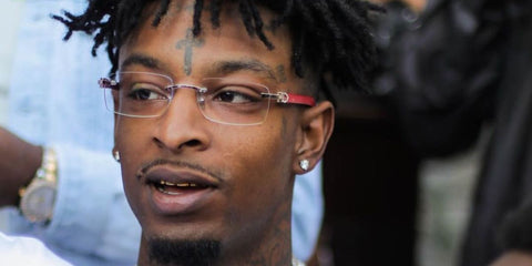 21 Savage is seen wearing Cartier Ibiza CT0052O 006 glasses with red wood temple