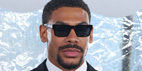Actor Aaron Pierre was seen wearing black Hugo Boss 1855/S 807KU sunglasses with blue lenses at the Hugo Boss Spring/Summer 2026 fashion show during Milan Fashion Week. Shop online now on Pretavoir