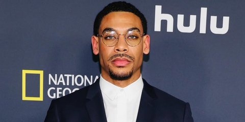 Aaron Pierre was seen wearing gold Ray-Ban Jack RB 6465 3086 round optical glasses to attend the LA Premiere of GENIUS: MLK/X