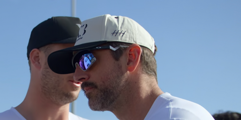 Aaron Rodgers wears Oakley BXTR OO9280 03 Prizm sunglasses in his new Netflix series 'Aaron Rodgers Enigma'.