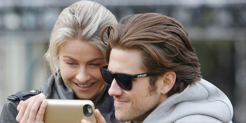 Aaron Tveit, pictured with Julianne Hough, was seen wearing black Oakley Frogskins OO9013 24-306 sunglasses, behind the scenes of "Grease Live!" in Los Angeles. Shop online now on Pretavoir