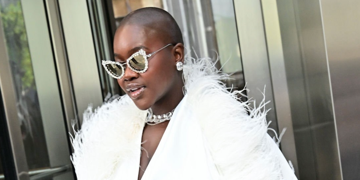 Content creator Achieng Agutu was seen wearing crystal-studded silver Swarovski SK7011 4001/AP sunglasses with Clip-On Trim during New York Fashion Week season Spring/Summer 2025. Shop online now on Pretavoir