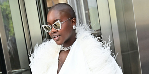Content creator Achieng Agutu was seen wearing crystal-studded silver Swarovski SK7011 4001/AP sunglasses with Clip-On Trim during New York Fashion Week season Spring/Summer 2025. Shop online now on Pretavoir