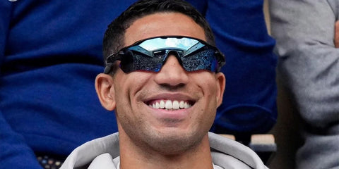 Moroccan football player Achraf Hakimi was seen wearing black Oakley Radar EV Path OO9208 55 sunglasses with deep blue Prizm Polarised lenses while watching Greenweez Paris Major match, October 2024