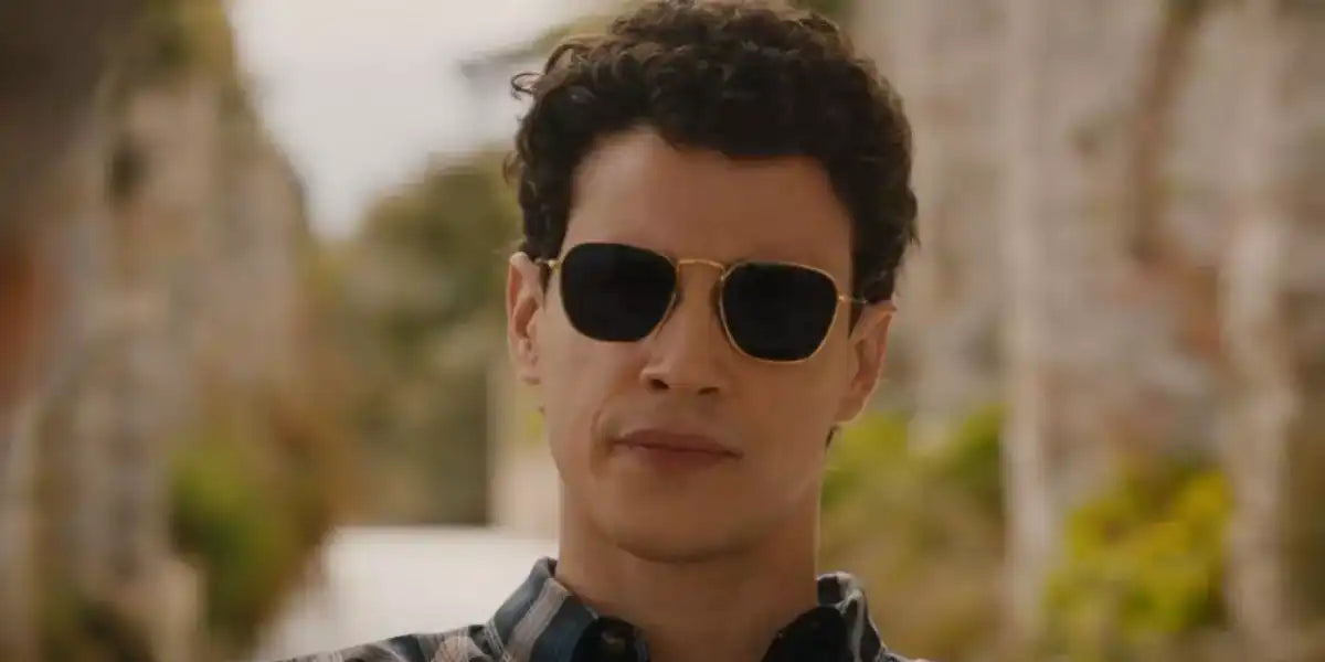 Adam DiMarco is seen wearing Ray-Ban Frank RB 3857 9196/31 sunglasses in the second season of The White Lotus