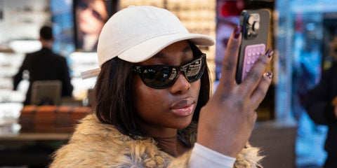 Media personality Adeola Patronne of The Receipts Podcast was seen wearing black Ray-Ban Mega Balorama RB 2289 901/31 sunglasses at Sunglasses Hut, shared through her social media post in December 2024.