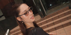 Singaporean-British model Aimee Cheng-Bradshaw was seen wearing black Ray-Ban RB 6421 2997 optical glasses with transition lenses in her Instagram post, November 2024
