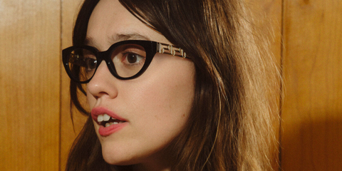 Aimee Lou Wood was seen wearing black Versace 3383 GB1 cat eye optical glasses in the Versace Greca Eyewear campaign, October 2025.
