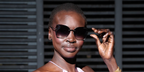 Supermodel Alek Wek was seen wearing Tom Ford Nickie-02 TF1107 16C butterfly sunglasses with grey gradient lenses at the Tom Ford Fall/Winter 2024 fashion show during Milan Fashion Week