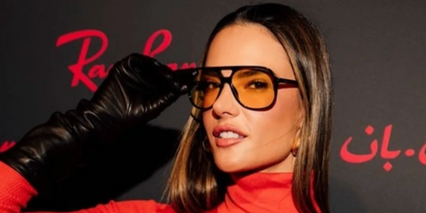 Alessandra Ambrosio was seen wearing black Ray-Ban Bill RB 2198 901/R6 aviator sunglasses with yellow lenses at the Doha Art Basel, February 2026.