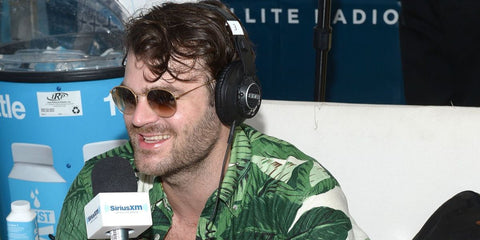 Alex Pall of The Chainsmokers was seen wearing gold Ray-Ban Round Metal RB 3447 001/51 sunglasses with brown gradient lenses 