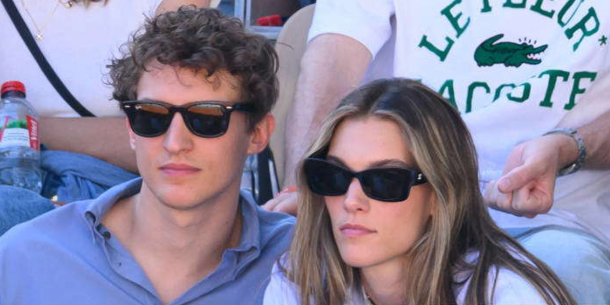 Aliocha Schneider , pictured with Charlotte Cardin, was seen wearing the iconic Ray-Ban Wayfarer 2140 901 Black sunglasses at the 2024 French Open