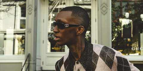 French-Senegalese model and creative director Alioune Badara Fall was seen wearing black Gucci GG1661S 001 sunglasses in a Gucci Holiday 2024 campaign