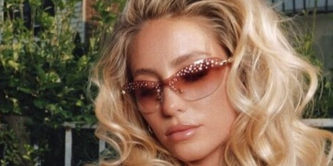 Alix Earle wears Swarovski SK7023 4013/8D sunglasses in Instagram post.