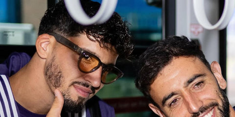 Turkish footballer Altay Bayindir, picrured with fellow Manchester United player Bruno Fernandes, was seen wearing stone Ray-Ban Meta Headliner RW4009 6705/ZX Photochromic Smart Glasses in his Instagram post, July 2025.