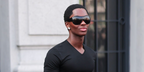 Supermodel Alton Mason was seen wearing black Gucci GG2168S 006 shield sunglasses at the Gucci Fall/Winter 2026 fashion show during Milan Fashion Week.