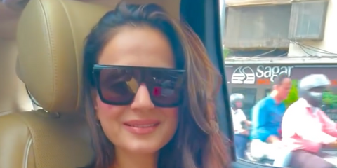 Bollywood actress Ameesha Patel was seen wearing black Saint Laurent Sun SL 607 001 mask sunglasses in her Instagram reel, November 2025.
