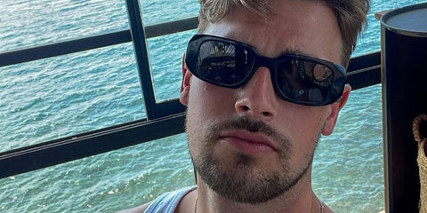 Television personality Andrew Le Page was seen wearing black Prada PR 17WS 1AB5S0 Symbole Sunglasses in his Instagram post, June 2025.