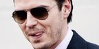 Andrew Scott was seen wearing rutherium Ray-Ban Aviator 3025 004/51 sunglasses with Grey/Brown Gradient lenses