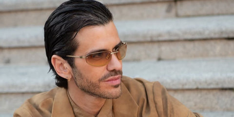 Model Andy McDougall was seen wearing gold Miu Miu MU A50S 5AK7R1 sunglasses ahead of the Idolo Awards 2025 in Madrid, Spain.