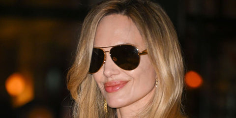 Angelina Jolie was seen wearing gold Bottega Veneta BV1305S 007 Sardine aviator sunglasses with brown lenses at the special screening of her new film "Couture" in New York City, June 2026.