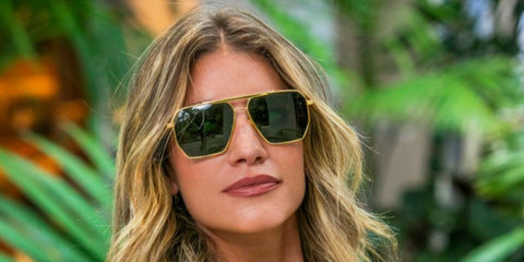 Model and influencer Angie Landaburu was seen wearing gold Bottega Veneta BV1012S 004 aviator sunglasses with green lenses.