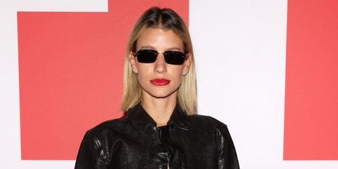 Model and influencer Angie Landaburu was seen wearing gold Gucci GG1221S 001 sunglasses with grey lenses at the Diesel Fall/Winter 2023 fashion show during Milan Fashion Week.