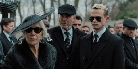 Anson Boon, pictured with Helen Mirren and Pierce Brosnan, was seen wearing black Ray-Ban Aviator 3025 002/58 Polarised sunglasses in 2025 Paramount+ series MobLand, as Eddie Harrigan