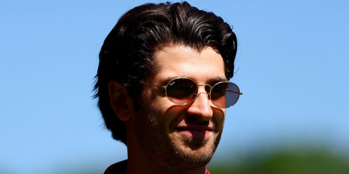 Italian racing driver Antonio Giovinazzi was seen wearing gold Ray-Ban Oval RB 3547 001/1A sunglasses with light violet lenses at the 2025 F1 Grand Prix of Spain