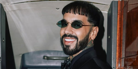 Puerto Rican singer Anuel AA was seen wearing gold Cartier Panthere CT0433S 003 diamond-shaped sunglasses with green lenses in his Instagram post, January 2025. Shop online now on Pretavoir