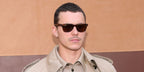 Spanish actor Aron Piper was seen wearing tortoiseshell Ray-Ban Wayfarer 2140 954 sunglasses with brown lenses at the Tod's Fall/Winter 2025 fashion show during Milan Fashion Week.