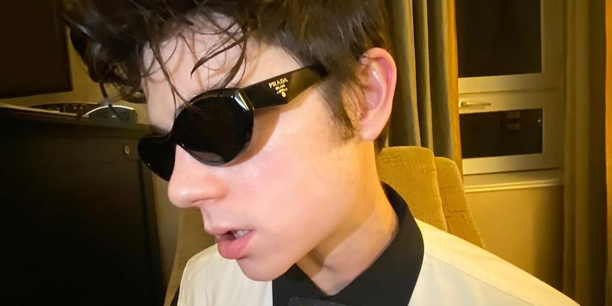 Ashby Gentry was seen wearing black Prada PR 26ZS 16K08Z cat eye sunglasses in Alberta, Canada, December 2023.