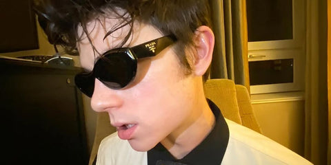 Ashby Gentry was seen wearing black Prada PR 26ZS 16K08Z cat eye sunglasses in Alberta, Canada, December 2023.