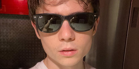 Ashby Gentry was seen wearing the iconic Ray-Ban New Wayfarer RB 2132 901 sunglasses in his Instagram post, December 2022.