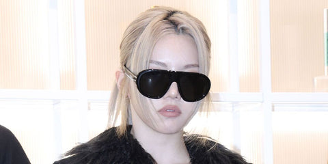 Singer and rapper Bailey Sok of AllDay Project was seen wearing black Prada PR C05S 16K08Z sunglasses at the VT Cosmetics "Skin Fitness Center" Seongsu pop-up store opening in Seoul, December 2025.