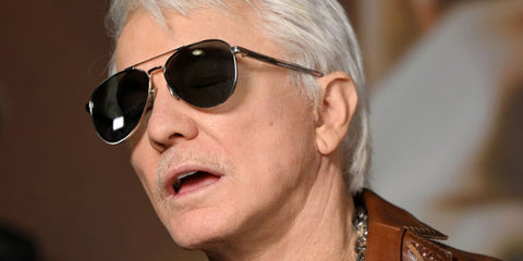 Australian film director Baz Luhrmann was seen wearing silver Prada PR A58S 1BC175 aviator sunglasses at the UK premiere of "EPiC: Elvis Presley in Concert", February 2026.