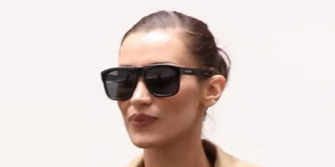 Bella Hadid wears Saint Laurent Sun SL 558 003 black oversized sunglasses while out in Paris - September 2024.