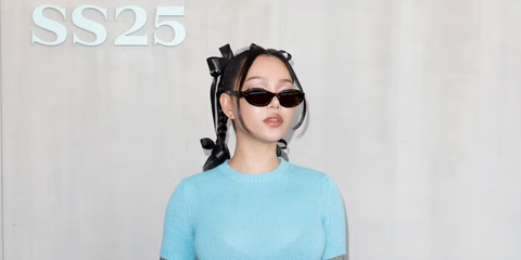 Singer and influencer Bella Poarch was seen wearing tortoiseshell Prada PR 26ZS 14L09Z cat eye sunglasses to attend Prada Spring/Summer 2025 fashion show during Milan Fashion Week. Shop online now on Pretavoir