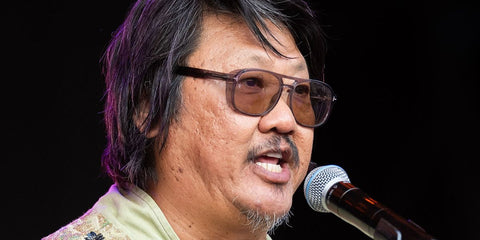 Actor Benedict Wong was seen wearing transparent grey Tom Ford Rosco TF1022 20E sunglasses with light grey Photochromic lenses at the 2026 Wilderness Festival
