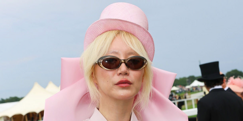 Filmmaker Betty Bachz was seen wearing transparent yellow Miu Miu MU B09S 24M50Q Reverie sunglasses at the Royal Ascot 2026.