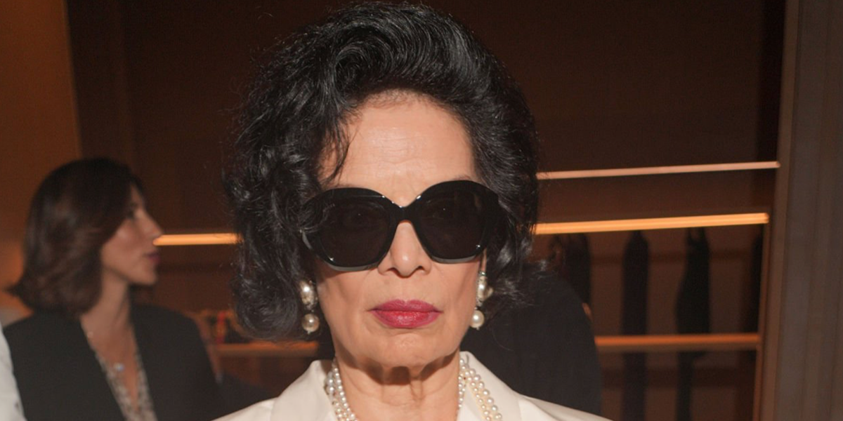 Bianca Jagger wore black Gucci GG2200S 001 geometric shape sunglasses at the Gucci Spring/Summer 2027 show during Milan Fashion Week.