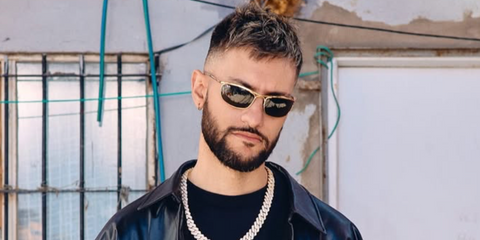 Music producer Big One was seen wearing gold Ray-Ban Olympian Deluxe RB 3119M 001/31 sunglasses in his Instagram post, October 2024.