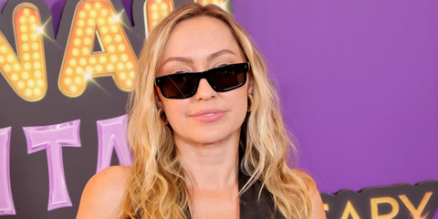 Miley Cyrus' sister Brandi Cyrus was seen wearing black Prada PR B11S 16K731 sunglasses at the world premiere of "Hannah Montana 20th Anniversary Special" in Los Angeles, March 2026.