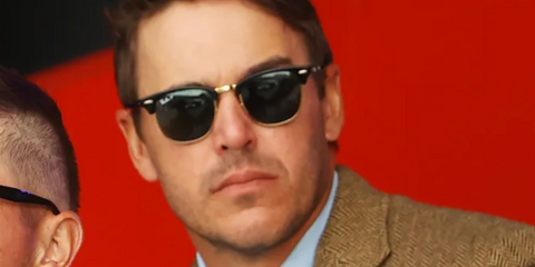 Professional golfer Brooks Koepka was seen wearing black Ray-Ban Clubmaster RB 3016 901/58 sunglasses wth Polarised lenses at the 43rd Ryder Cup opening ceremony.