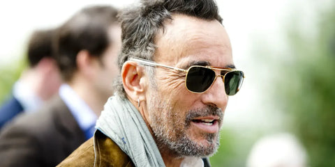 Bruce Springsteen was seen wearing Randolph Aviator II 23K Gold AT007 sunglasses with green lenses at a Rolling Stone Magazine feature.