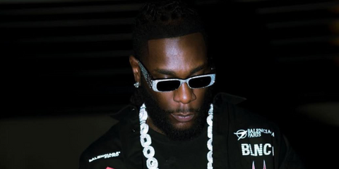 Burna Boy was seen wearing crystal studded Balenciaga BB0096S 013 sunglasses