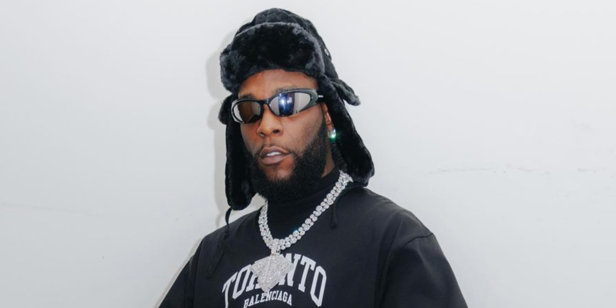 Burna Boy was seen wearing black Balenciaga BB0253S 001 shield sunglasses in Toronto