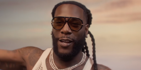 Burna Boy was seen wearing black Bottega Veneta BV1274S 002 aviator sunglasses with yellow lenses in the World Cup 2026 official music video Dai Dai with Shakira.