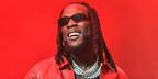 Burna Boy was seen wearing black Prada PR 17WS 1AB5S0 Symbole Sunglasses