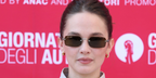 Cailee Spaeny was seen wearing Miu Miu MU B50S 26C09Z rimless sunglasses with dark brown lenses at the Miu Miu Women's Tales during Venice Film Festival 2026.